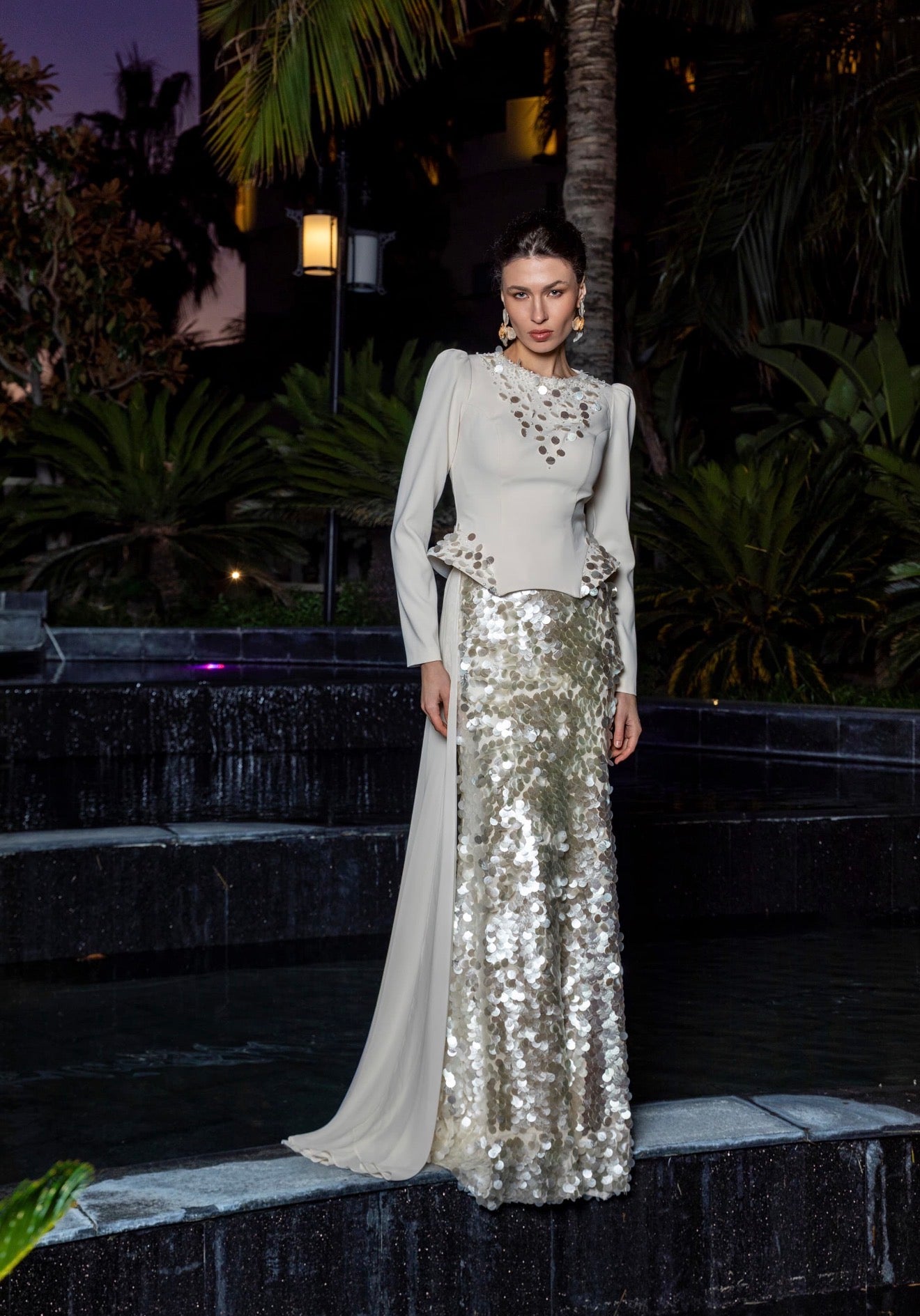 Elegant crepe gown adorned with 1997
