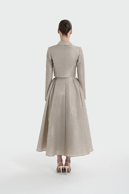 Elegant champagne two-piece set featuring a structured top and a flowing A-line skirt. 9175