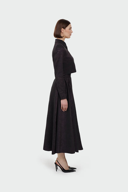 Elegant champagne two-piece set featuring a structured top and a flowing A-line skirt. 9175