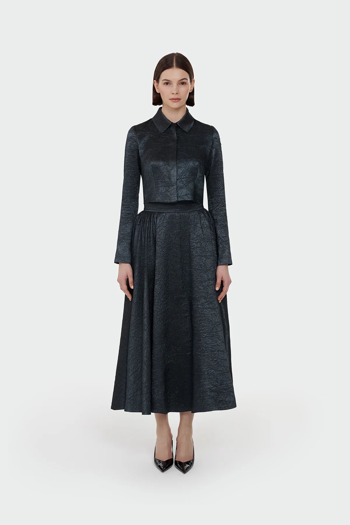 Elegant champagne two-piece set featuring a structured top and a flowing A-line skirt. 9175