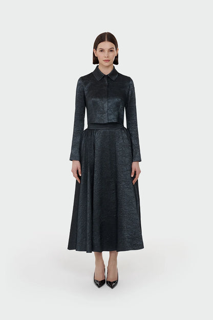 Elegant champagne two-piece set featuring a structured top and a flowing A-line skirt. 9175