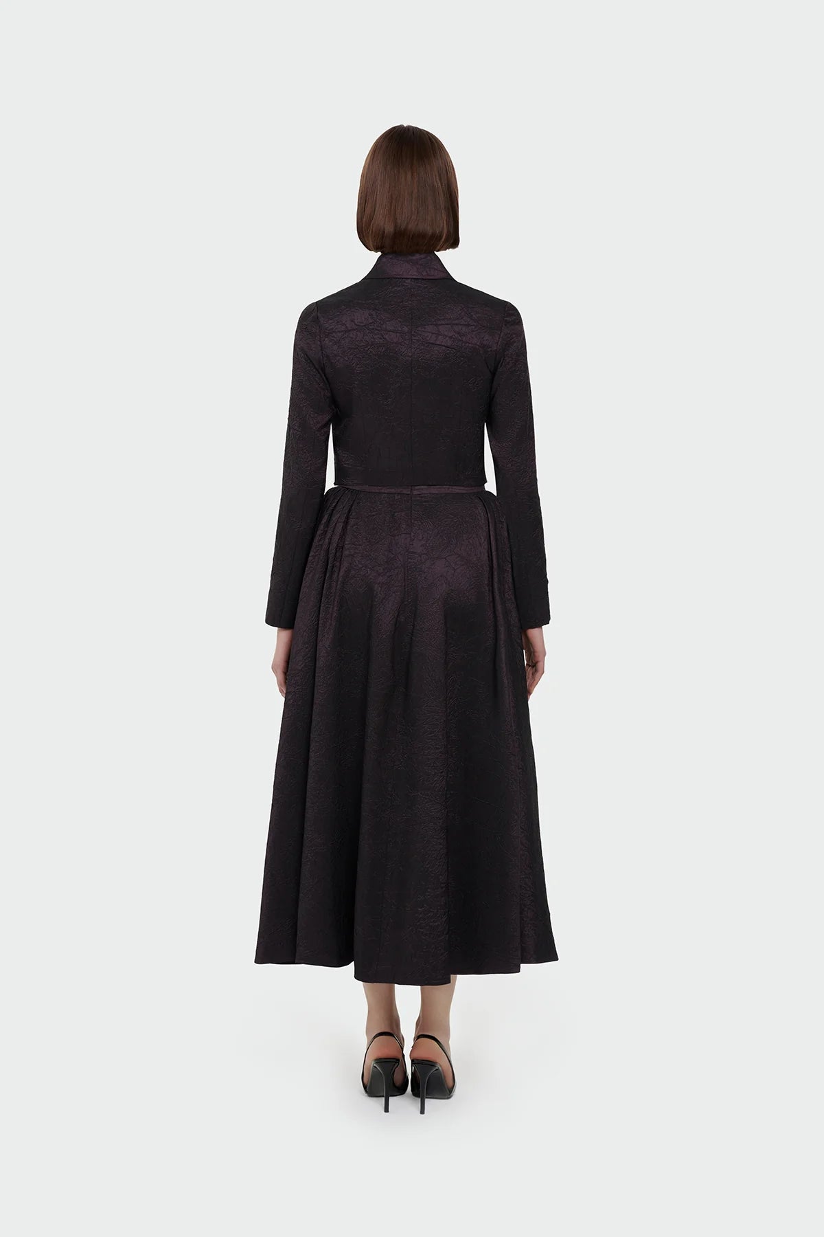 Elegant champagne two-piece set featuring a structured top and a flowing A-line skirt. 9175