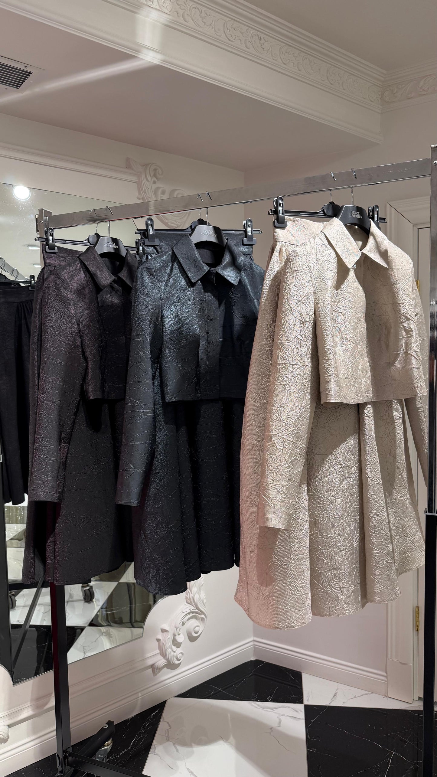 Elegant champagne two-piece set featuring a structured top and a flowing A-line skirt. 9175