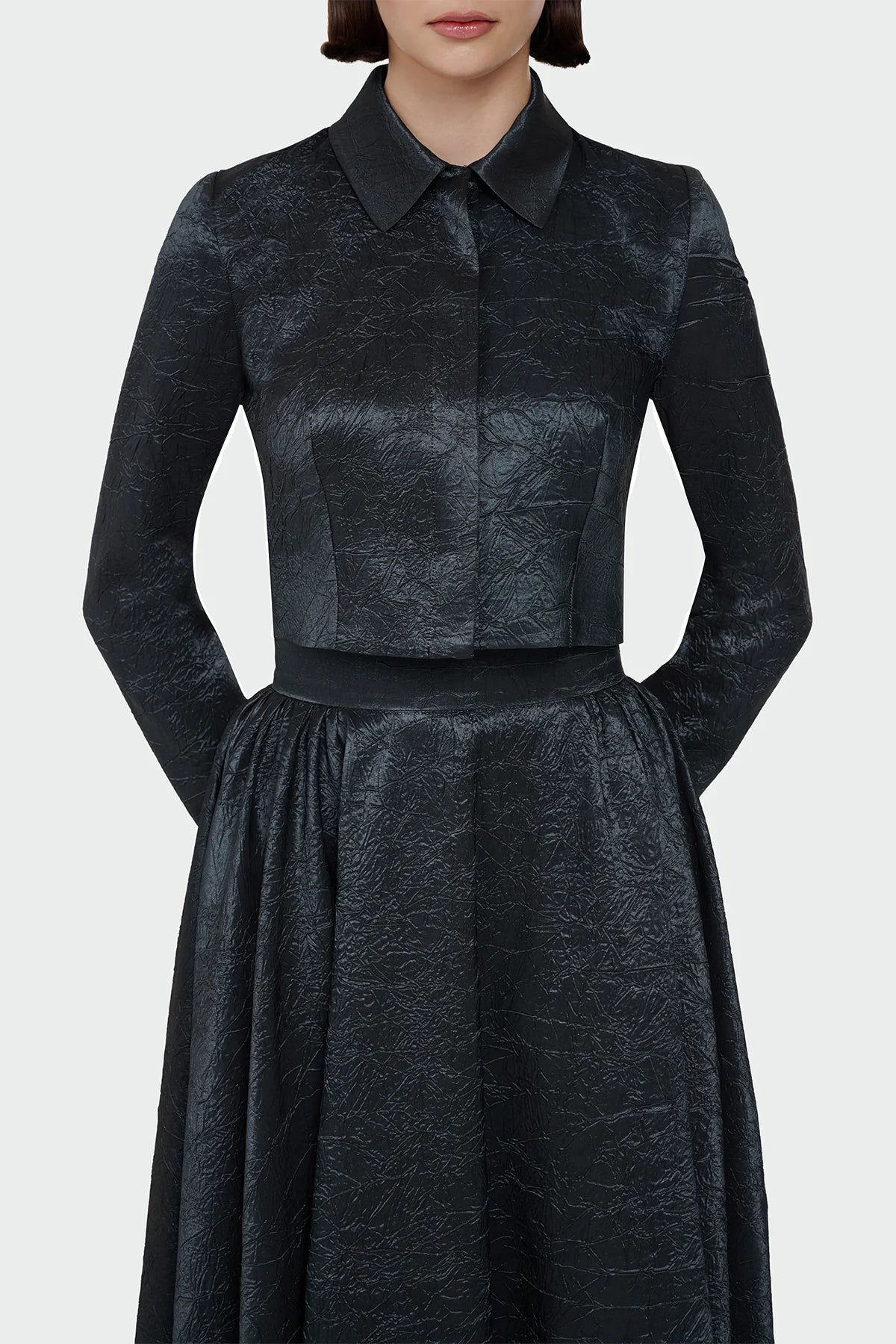 Elegant champagne two-piece set featuring a structured top and a flowing A-line skirt. 9175