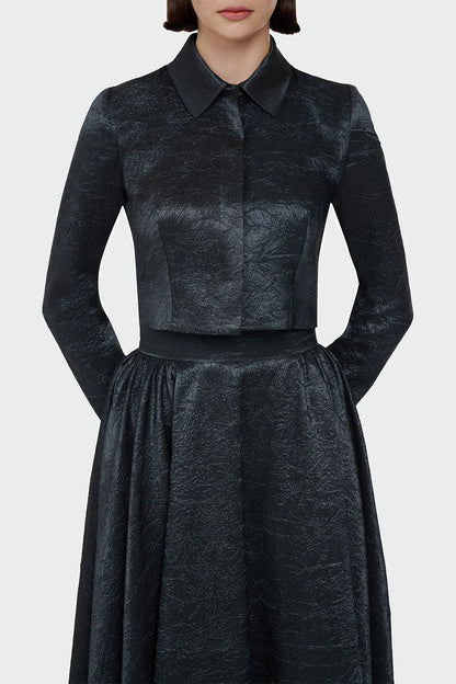 Elegant champagne two-piece set featuring a structured top and a flowing A-line skirt. 9175